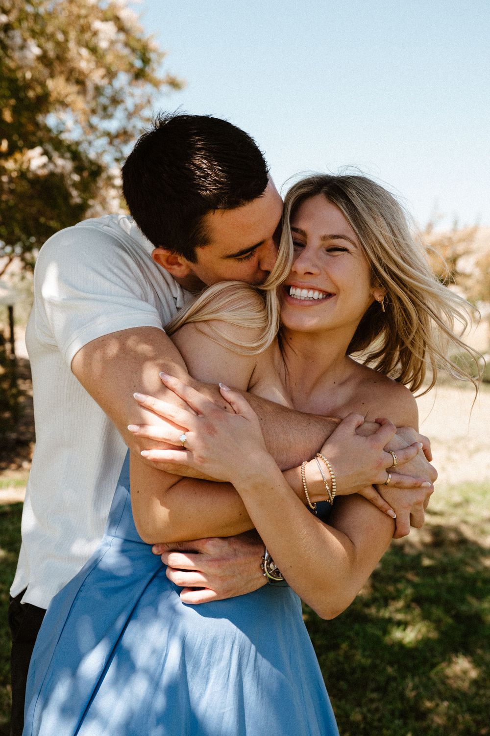 Affectionate couple embraces and shares tender moments in a series of romantic outdoor photos.
