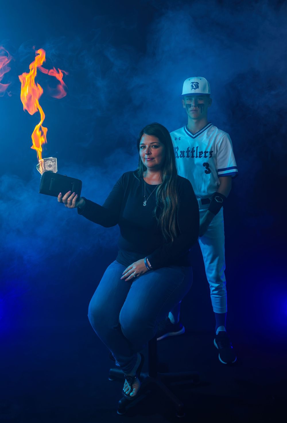 Sports-themed portrait with fire effect against blue smoke backdrop.