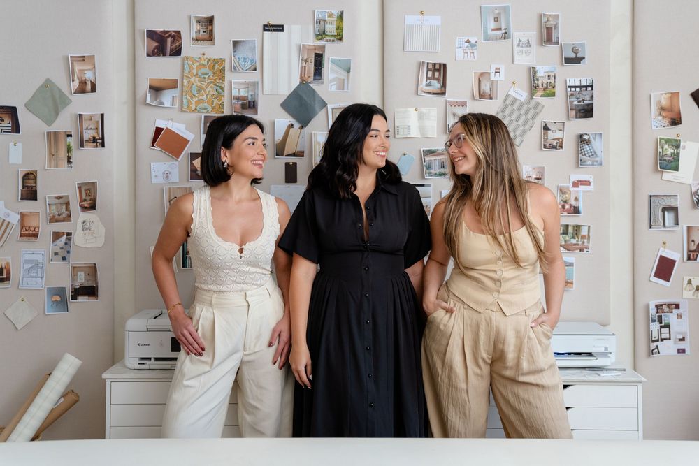 A series of photos showing candid office moments with people collaborating in front of a white wall covered in pinned images.