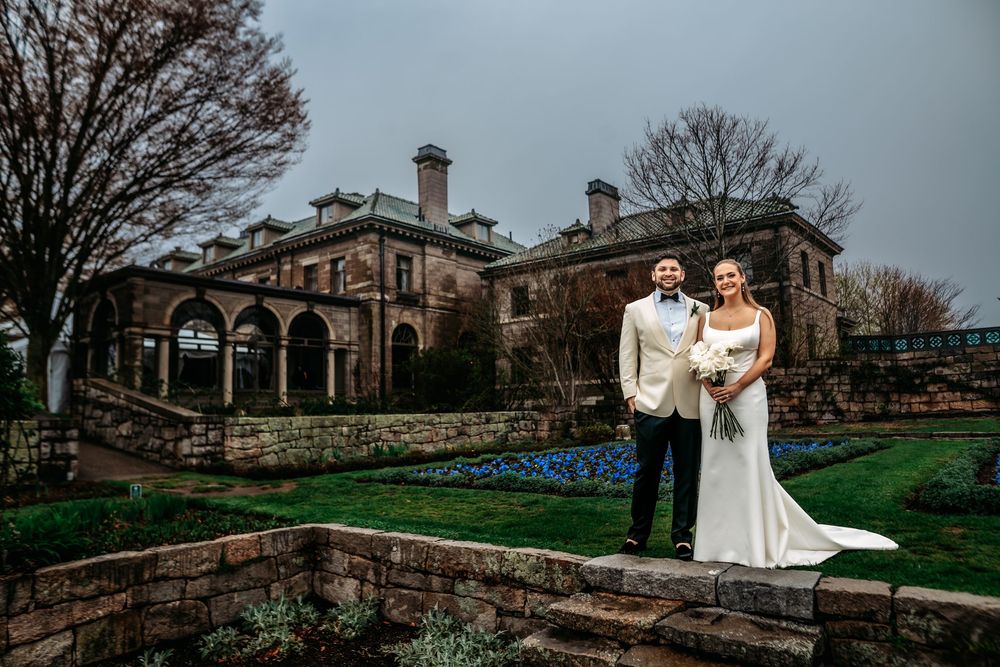 A series of wedding photos taken at a historic stone mansion with elegant archways and landscaped grounds.