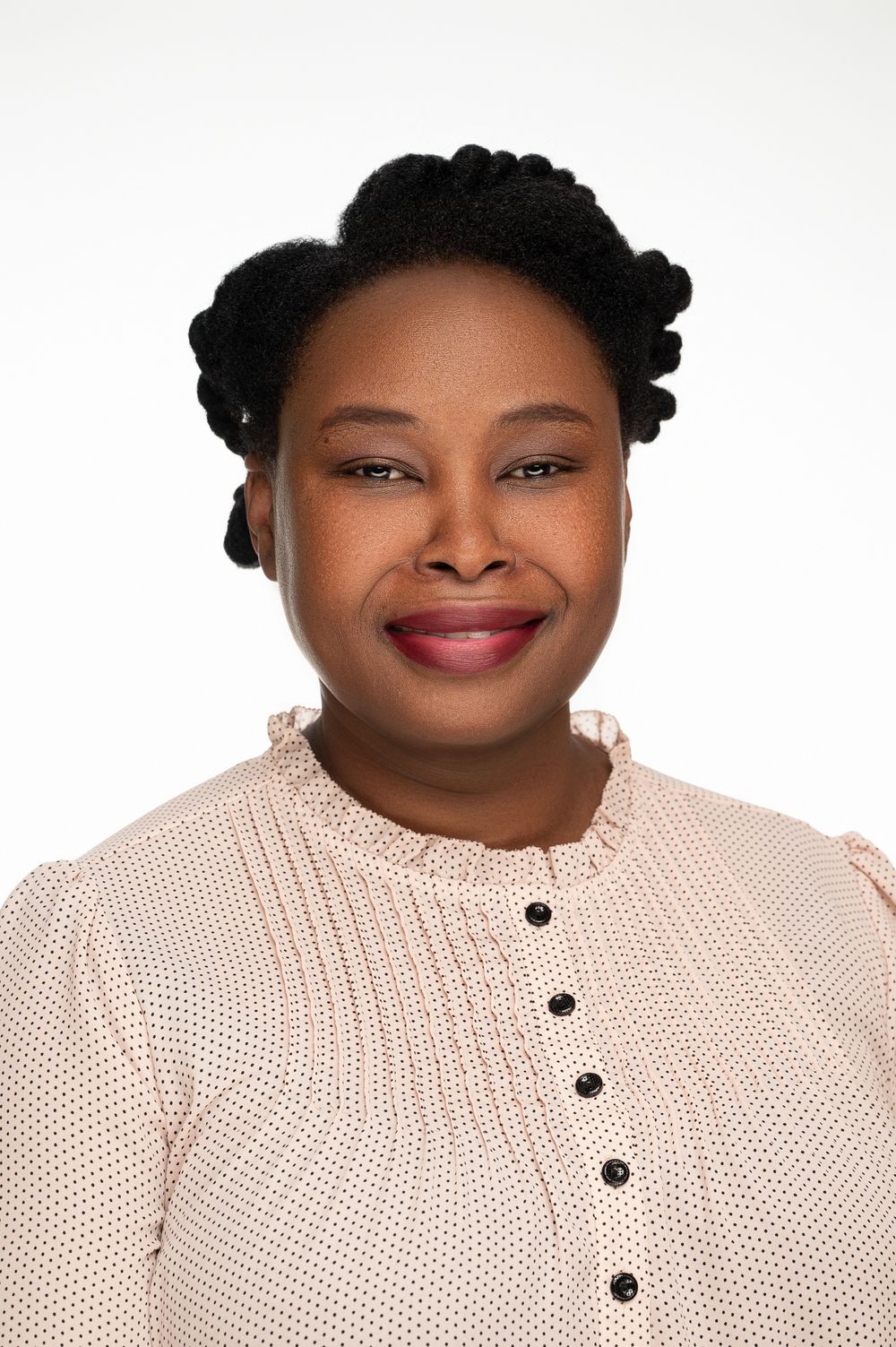 A series of headshots showing someone wearing a cream colored knit sweater with black buttons against a white background.