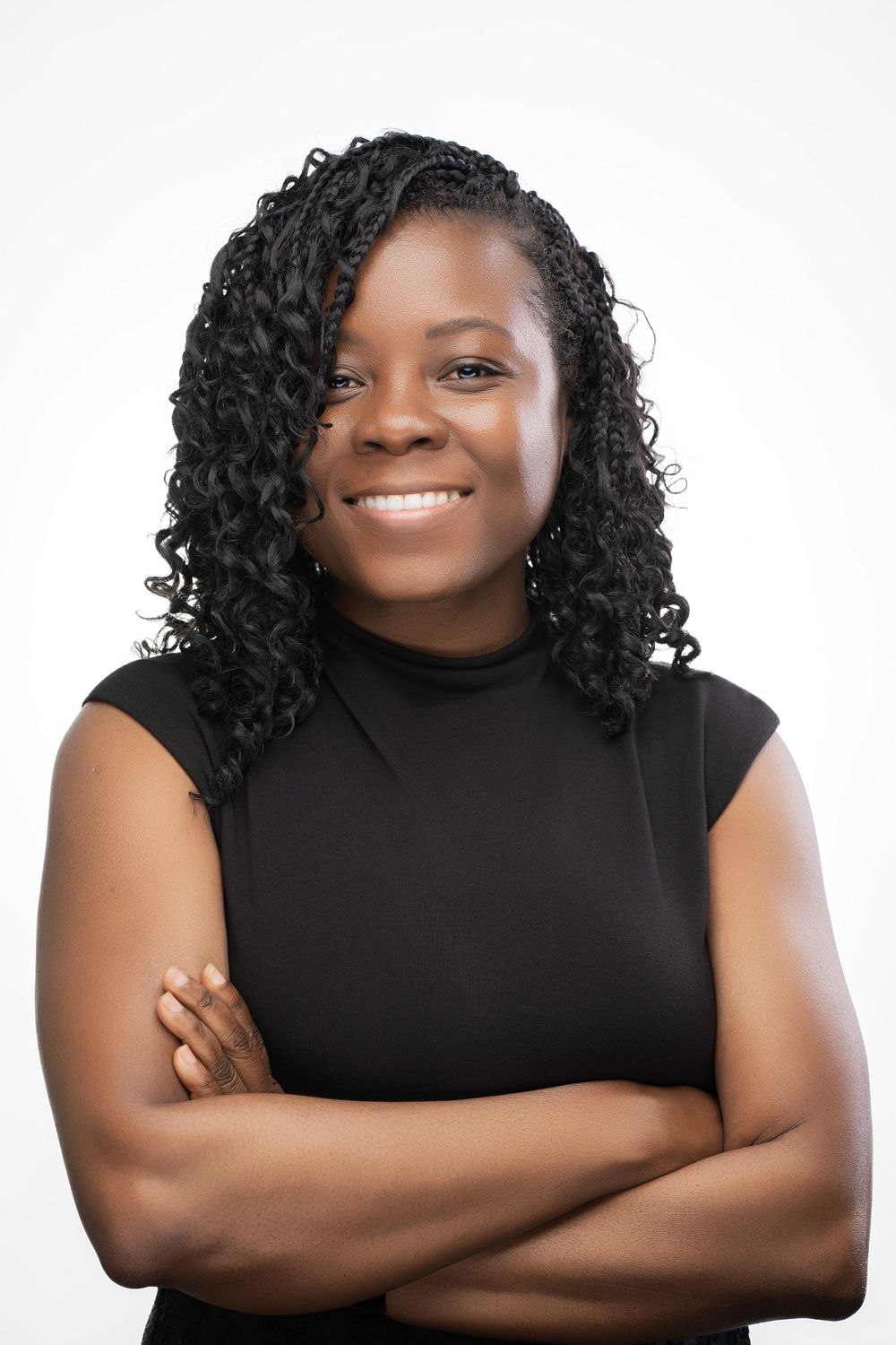 A person in a black sleeveless top poses with crossed arms in a series of similar shots against a white background.