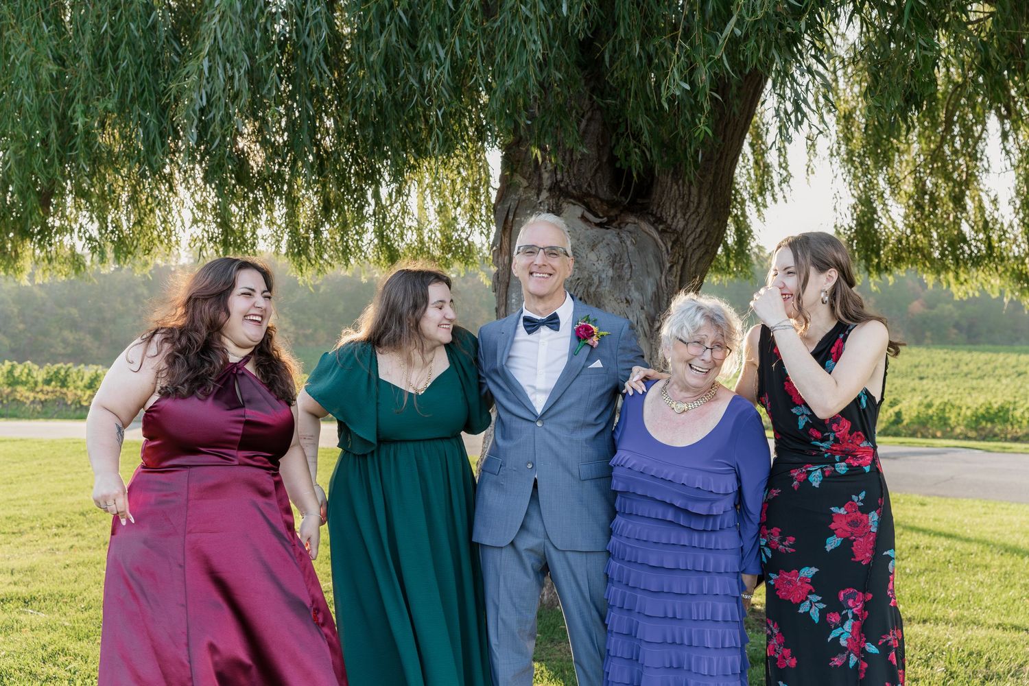 Wedding group photo of groom and his daughters and 'mother' under the willow tree at Vineland Estates Winery.
