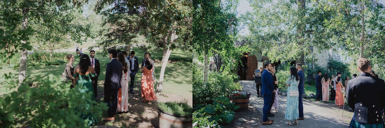 Wedding celebration in a lush garden setting with guests gathered under trees.
