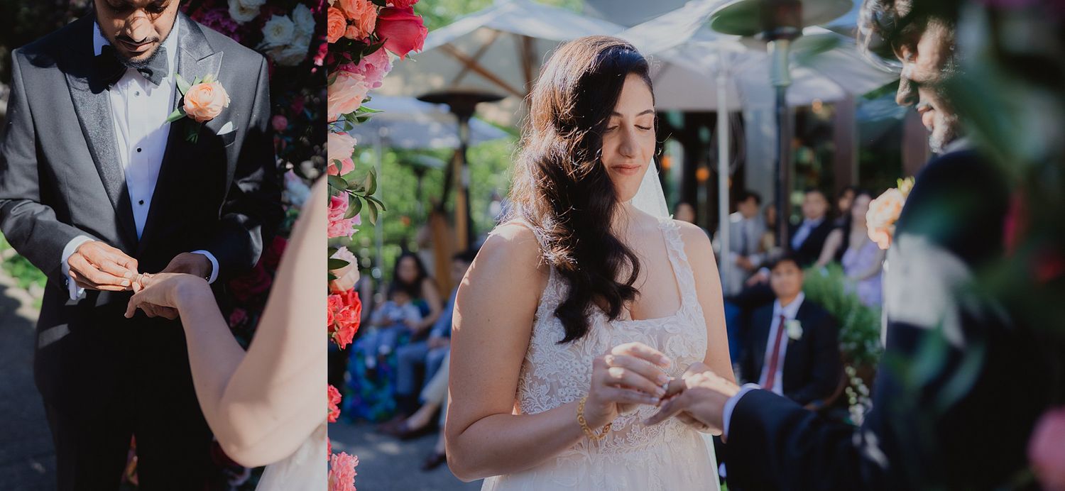 Wedding party celebrates during outdoor reception with vibrant floral arrangements.