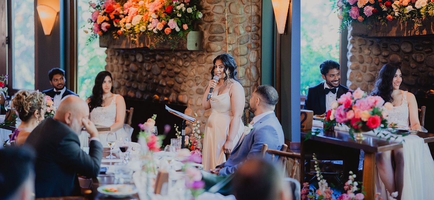 Colorful floral arrangements and decorations adorn tables at an indoor wedding reception.