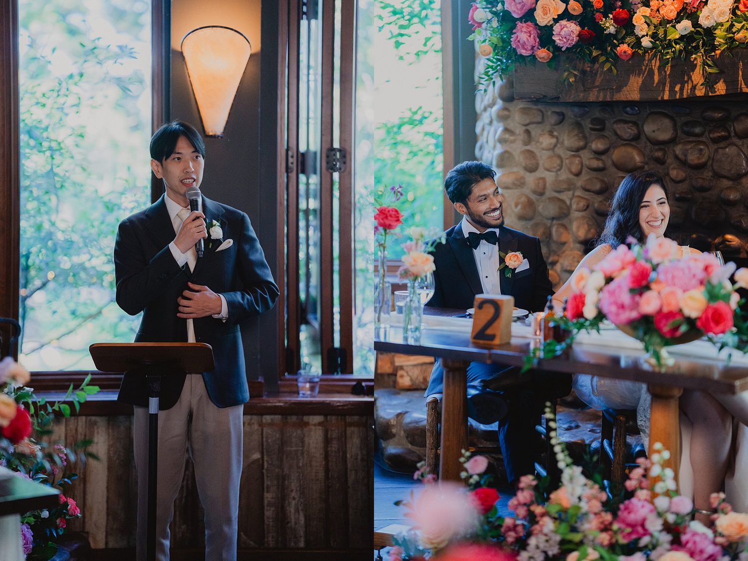 Wedding reception venue with stone walls features romantic lighting and pink floral arrangements on dining tables.