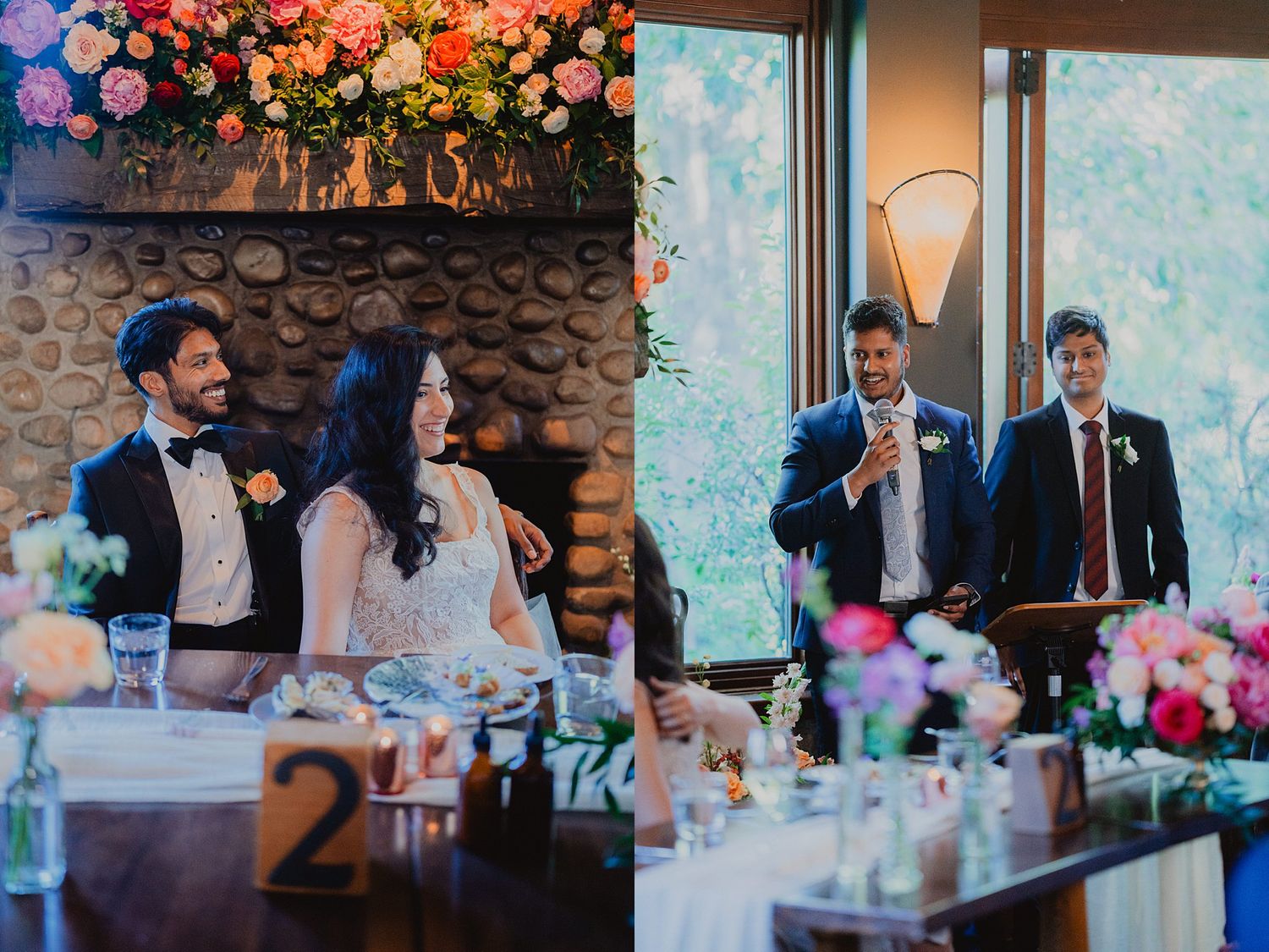 Wedding reception table decorated with floral arrangements and table numbers as guests enjoy speeches and toasts.