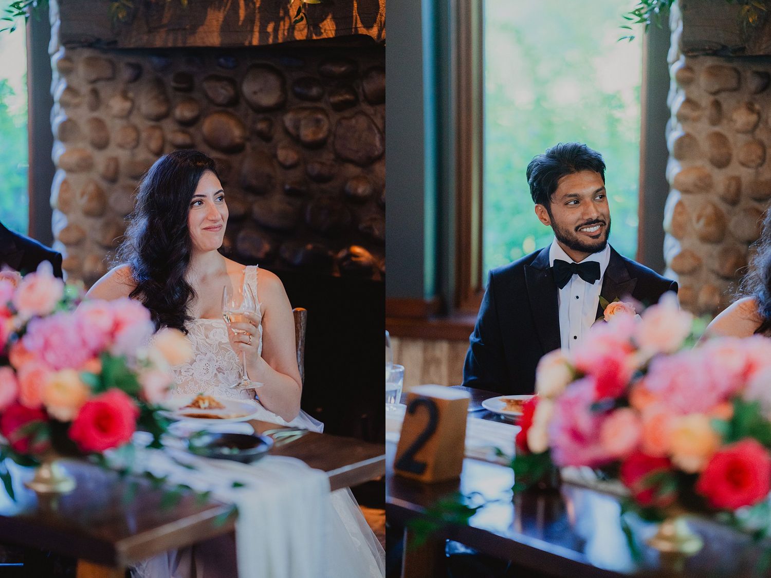 Wedding reception dinner scene with stone walls, warm lighting and vibrant pink floral arrangements.