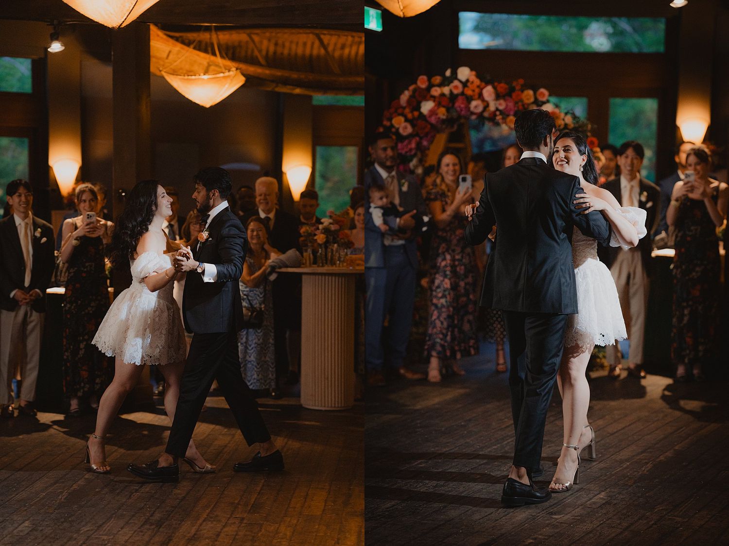 Wedding guests dance and celebrate on a warmly lit indoor reception dance floor.