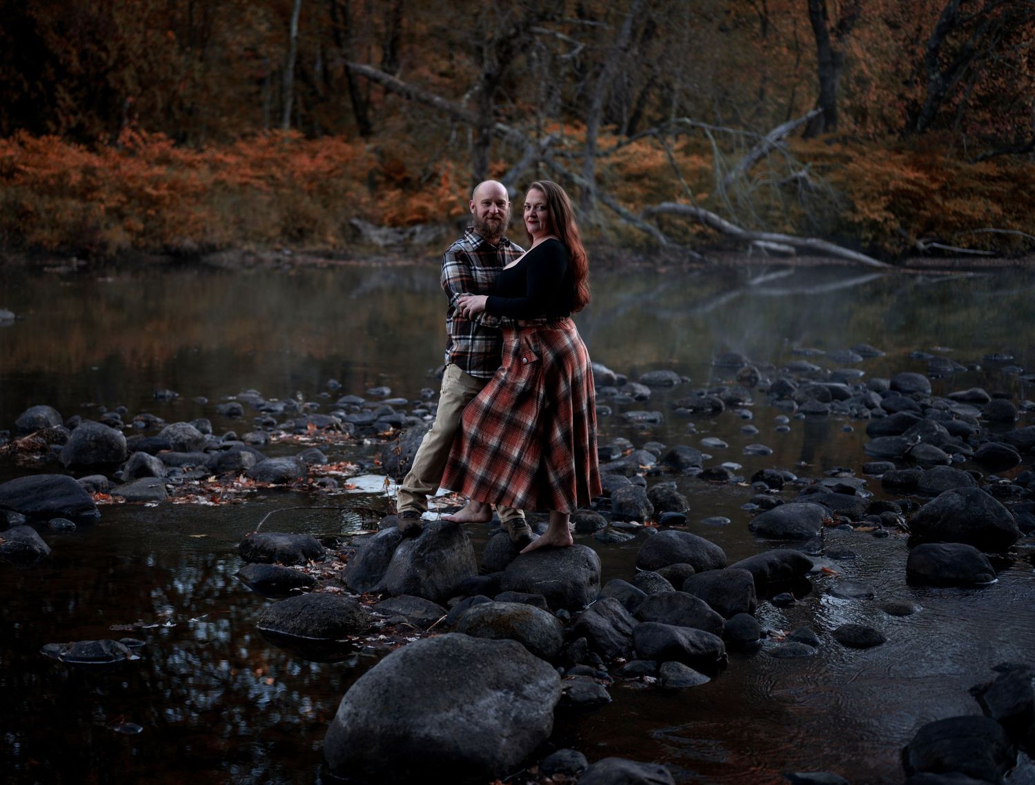 A series of photos showing people exploring a rocky creek bed surrounded by autumn foliage and fallen leaves.