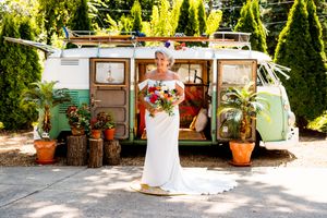 Rustic wooden lodge venue with potted flowers and decorative elements along the outdoor patio area.