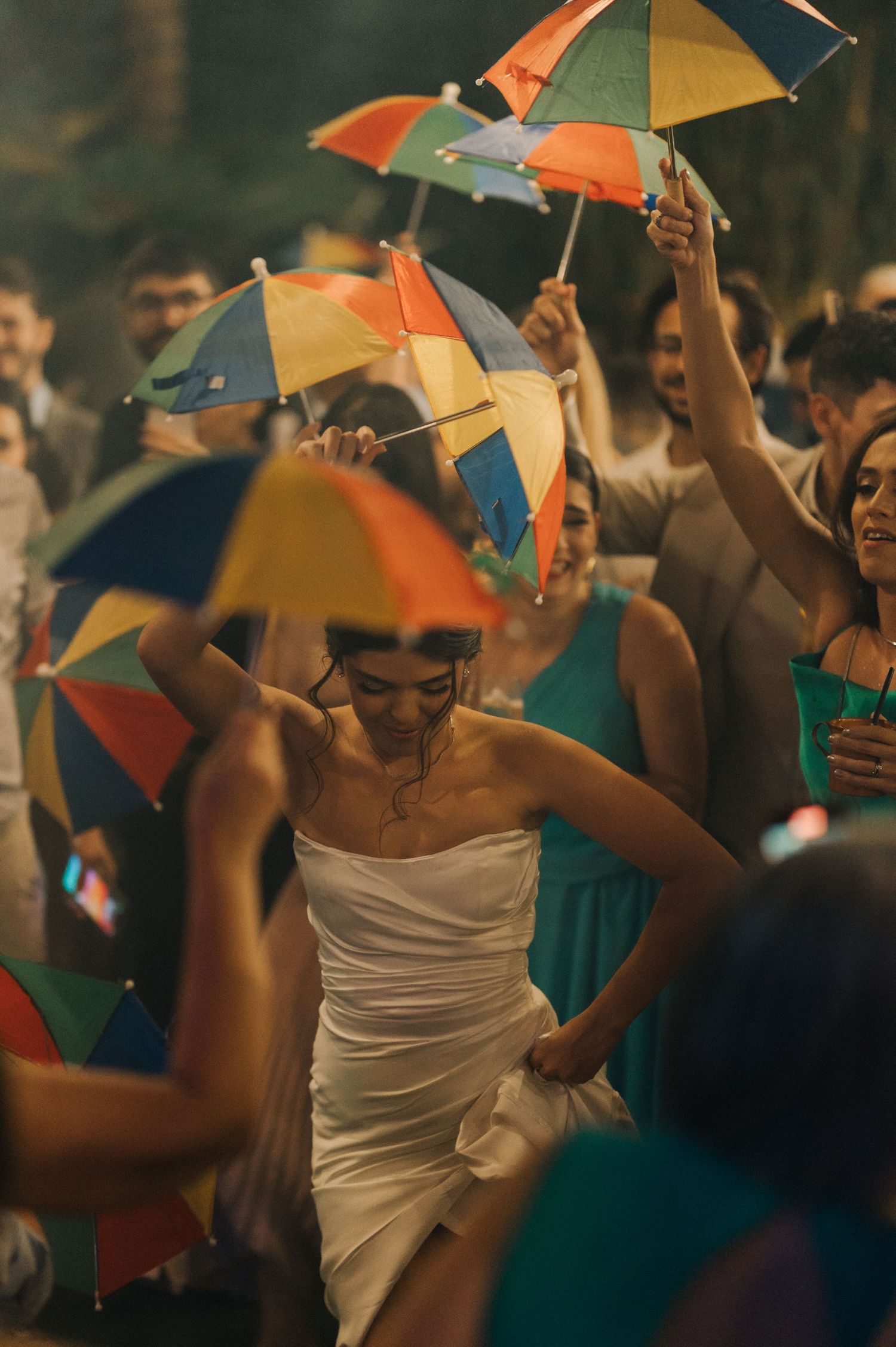 Celebration with colorful parasols at an outdoor wedding reception.