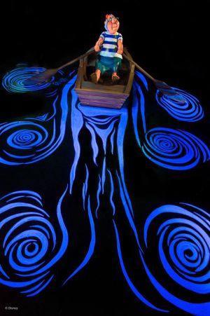 A sequence of glowing blue spiral light patterns against a black background with progressively changing abstract designs.