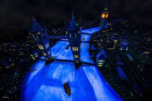 Aerial cityscape illuminated in vibrant blue lights at night with a river flowing through urban buildings and bridges.