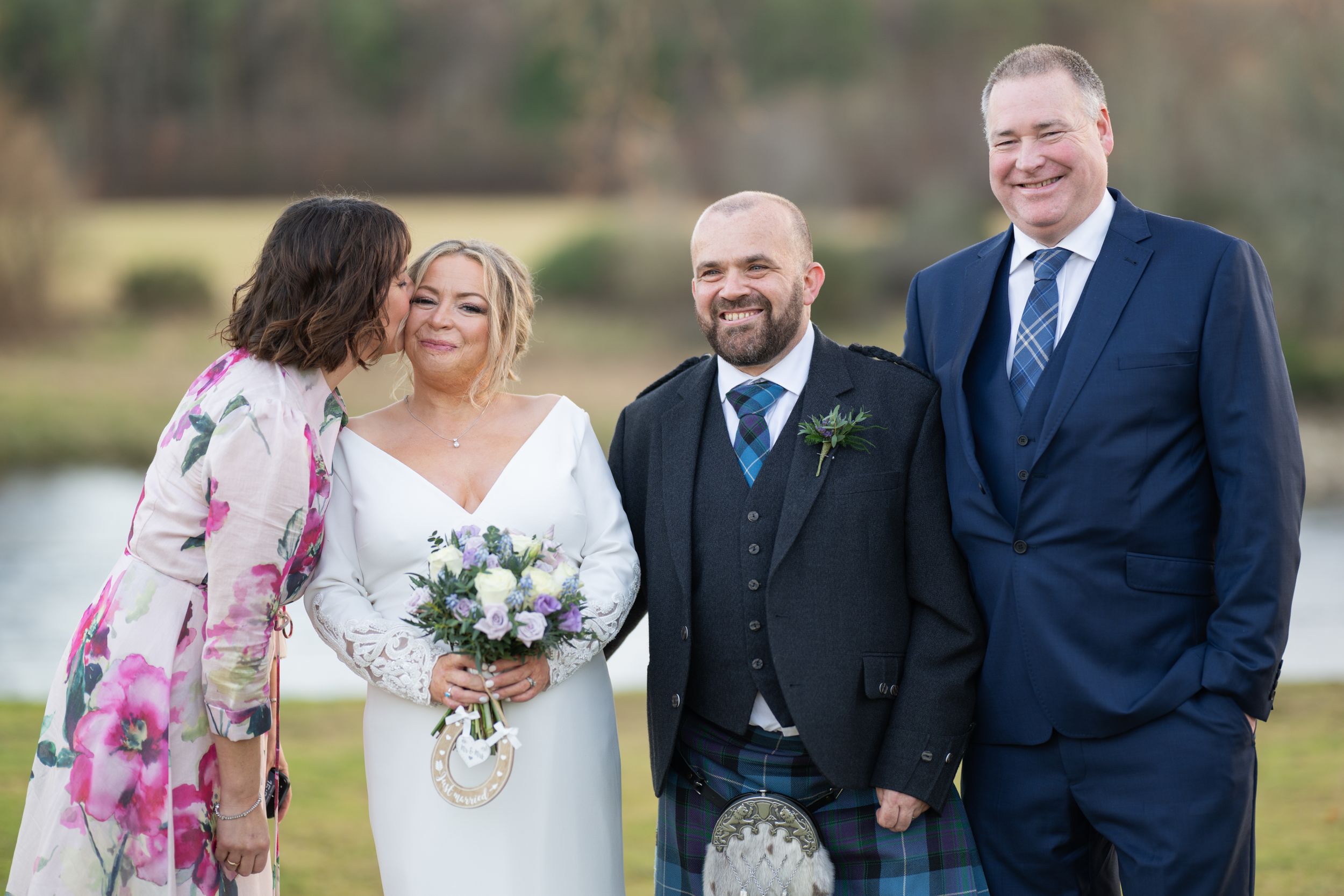 Bride and groom with friends at banchory lodge hotel