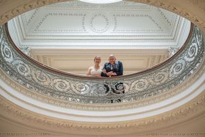 Ornate ceiling moldings and architectural details in a historic building.