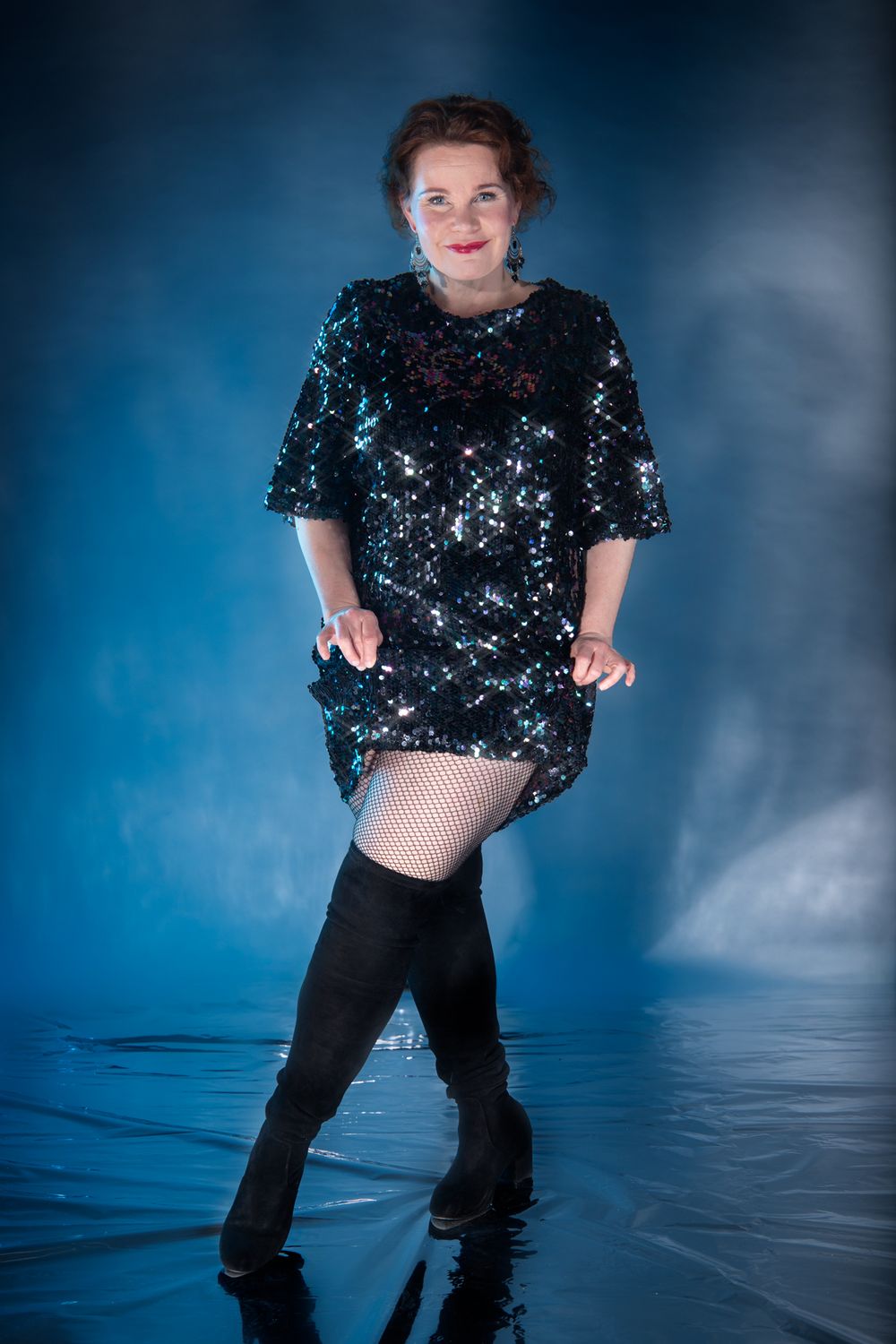 A glamour studio portrait photo of a woman
