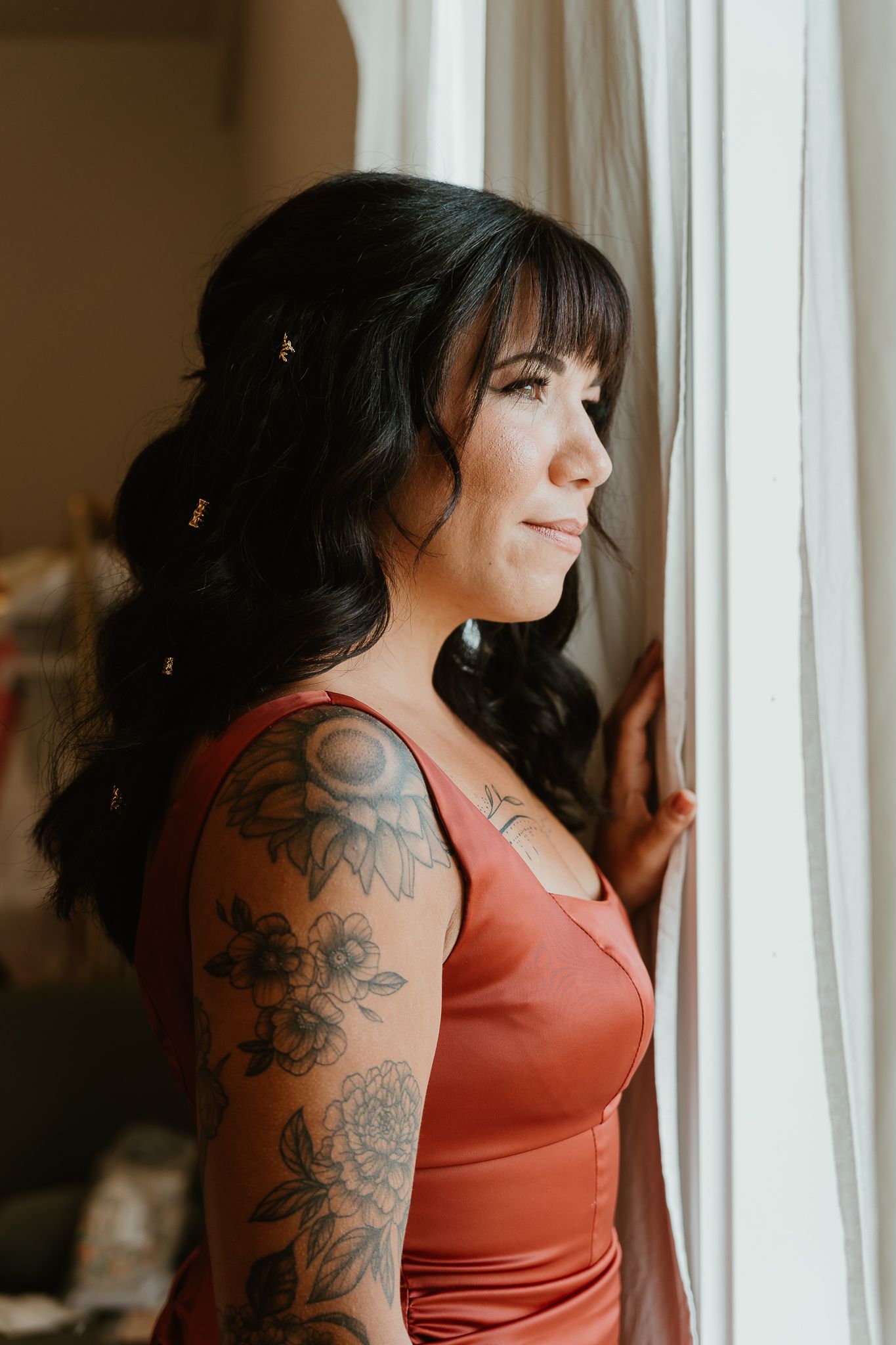Bridesmaid looking out window.