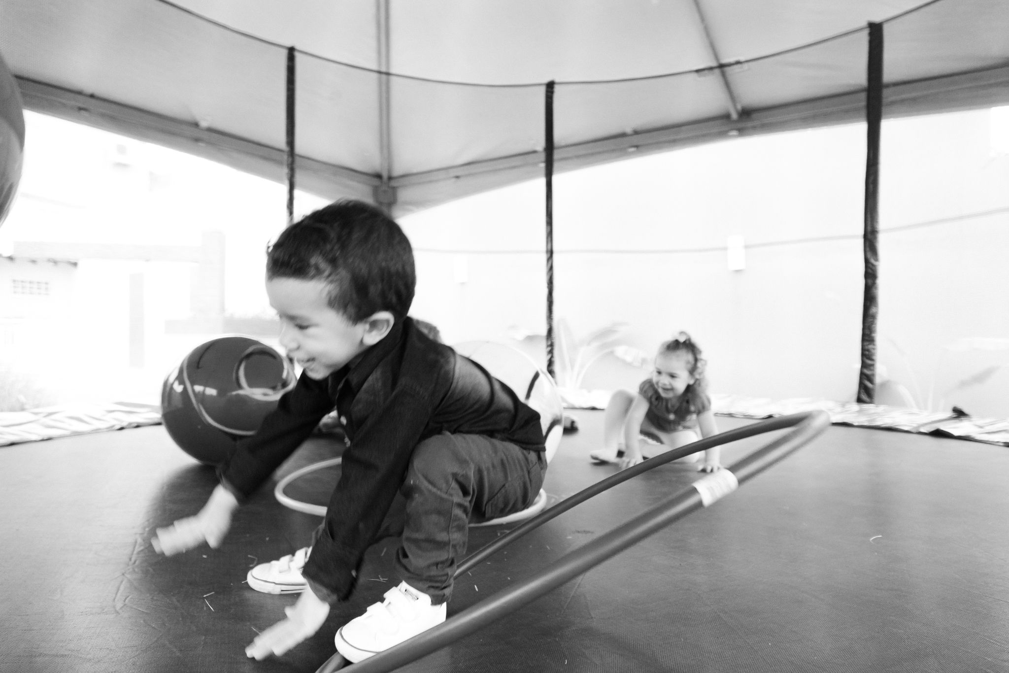 A person performing ground exercises using resistance bands in a fitness studio.