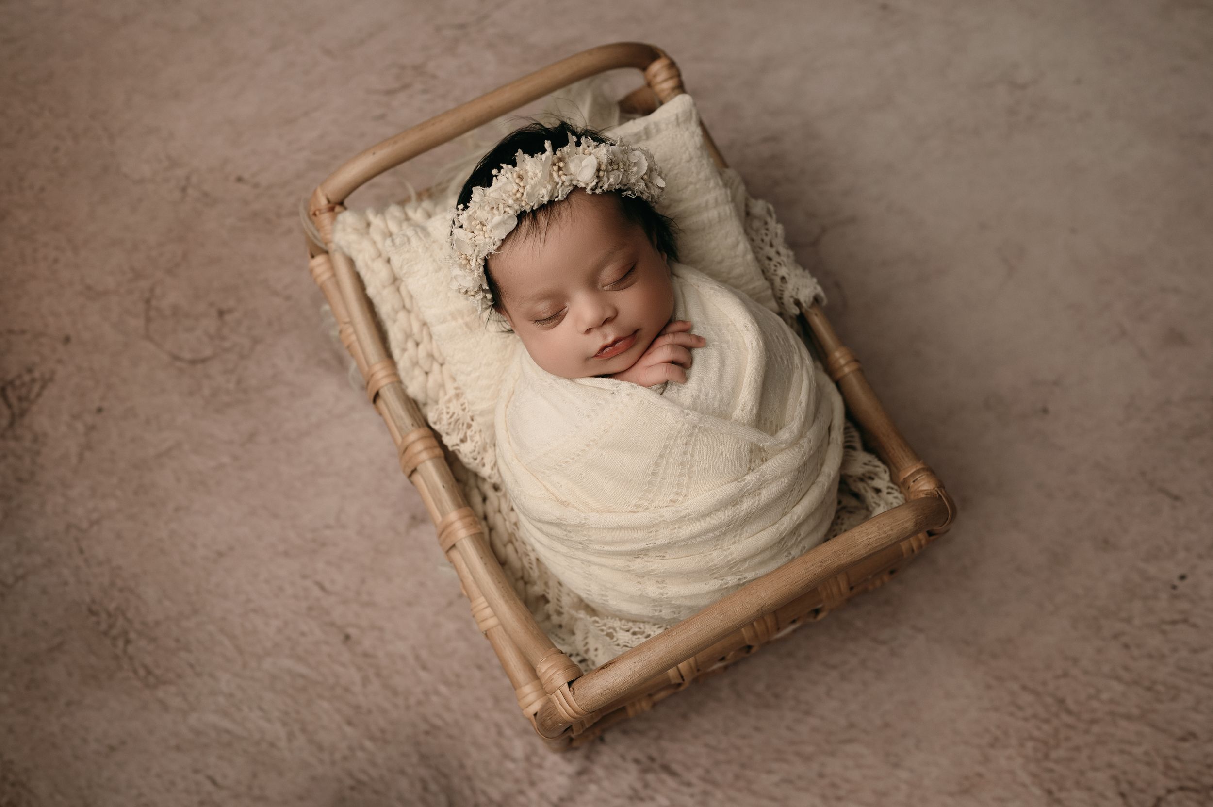 A newborn baby peacefully sleeping on vintage rustic wood frames arranged in a progression of images.