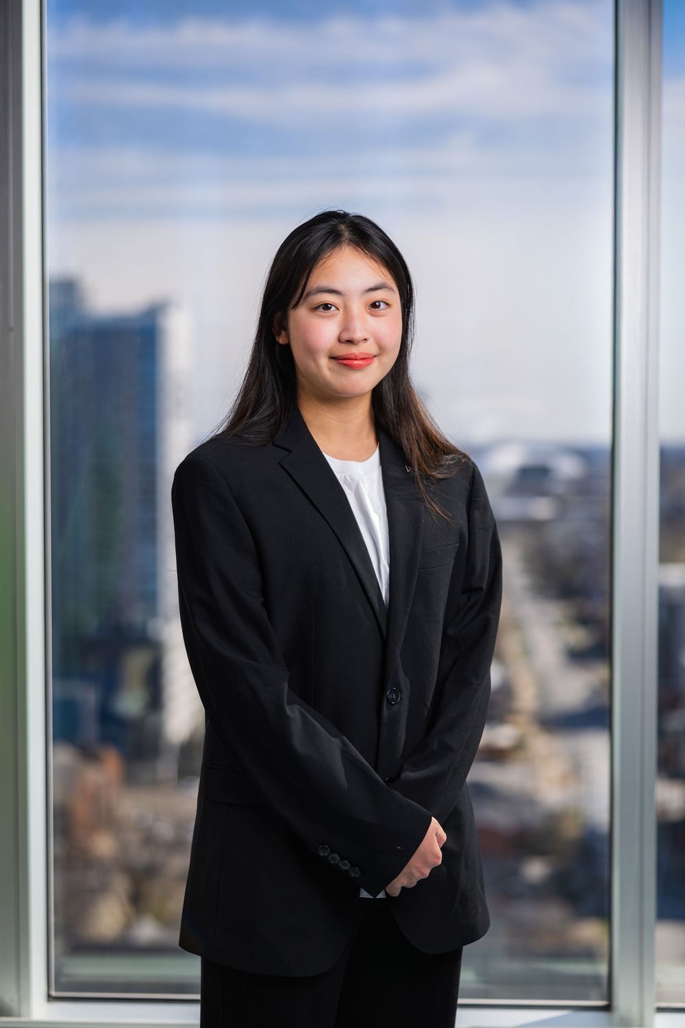 Professional headshot of a Chinese student at UIUC wearing a suit