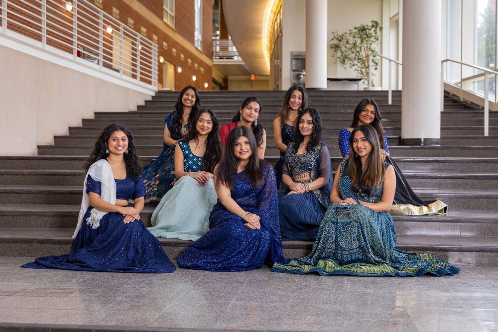 Group of woman students sitting together on the Temple Hoyne Buell Hall stairs at UIUC