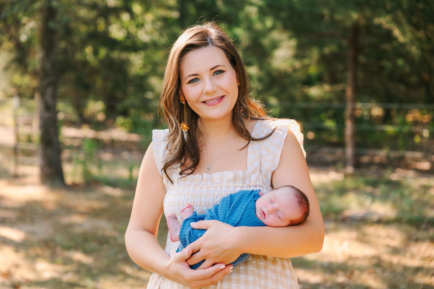 A series of outdoor family portraits showing tender moments between mother and baby in a sunlit forest setting.