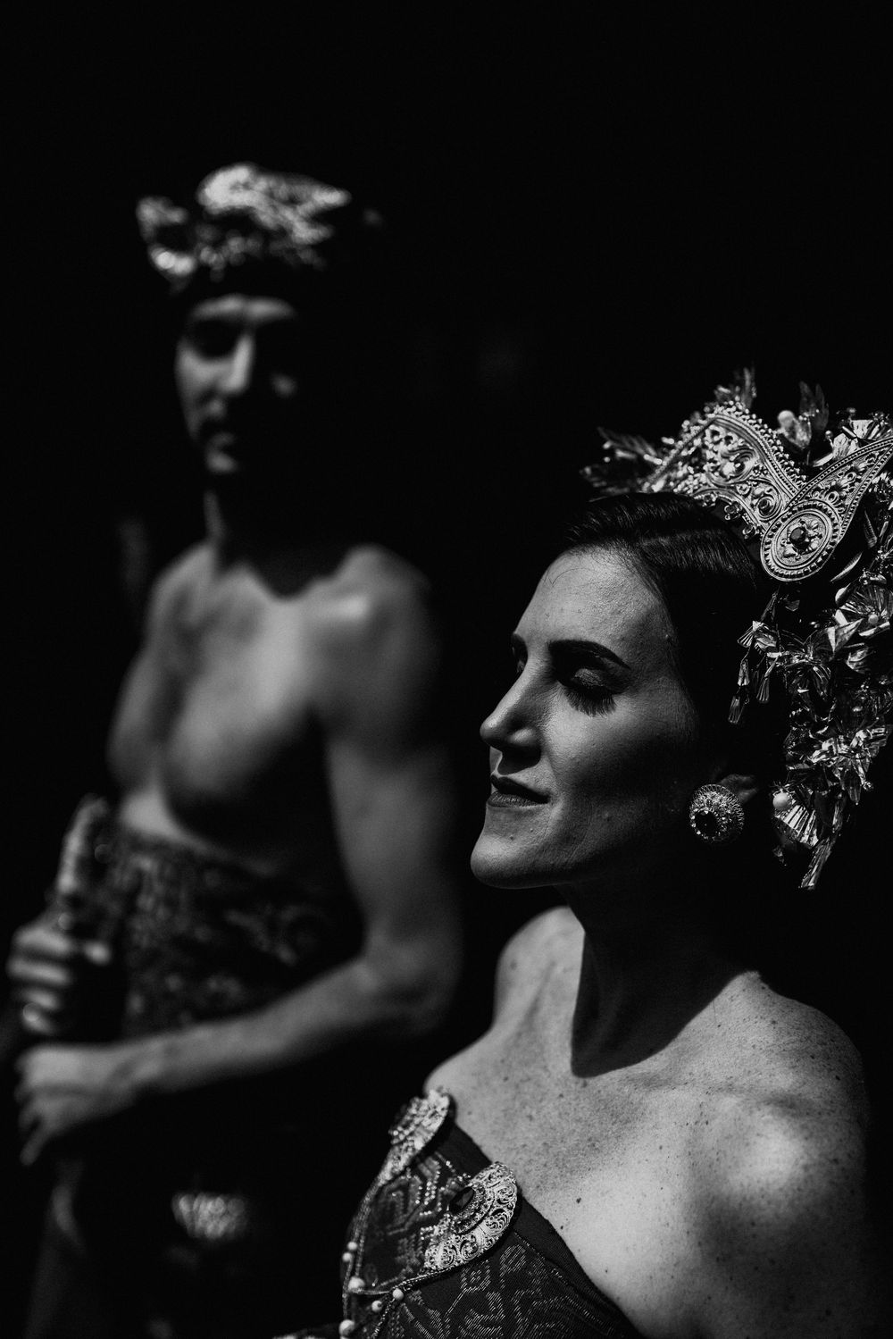 Artistic black and white portrait showing intricate details of traditional Balinese bridal headdress.