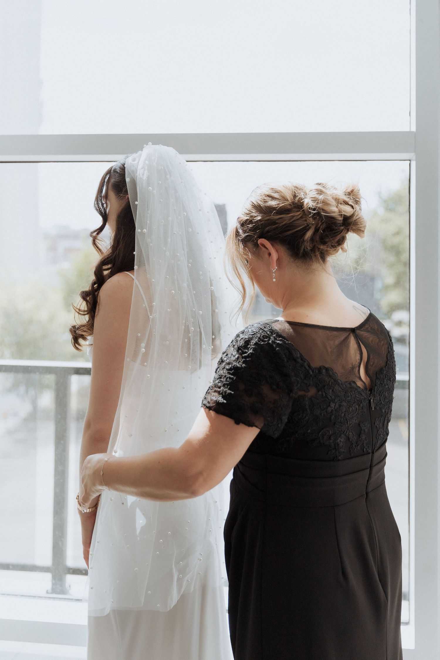 Mother fixes bride's veil editorial fine art wedding photography Moncton photographer New Brunswick wedding packages two photographers