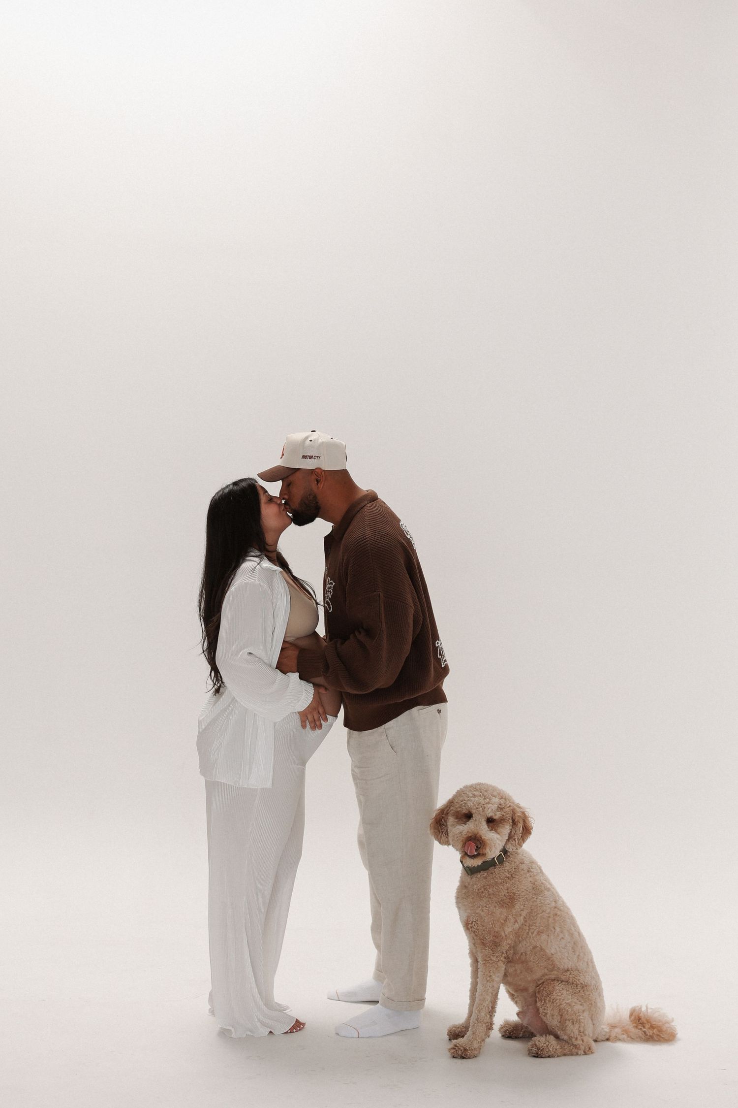Maternity photoshoot indoors with clean, modern studio style