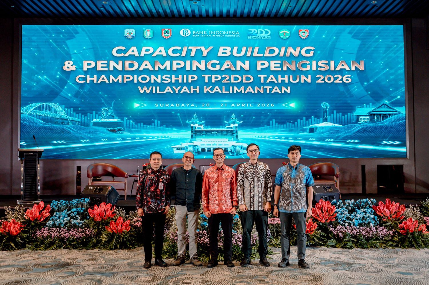 Five professionals pose at Capacity Building & Pendampingan Pengisian Championship TP2DD 2026 Wilayah Kalimantan event.