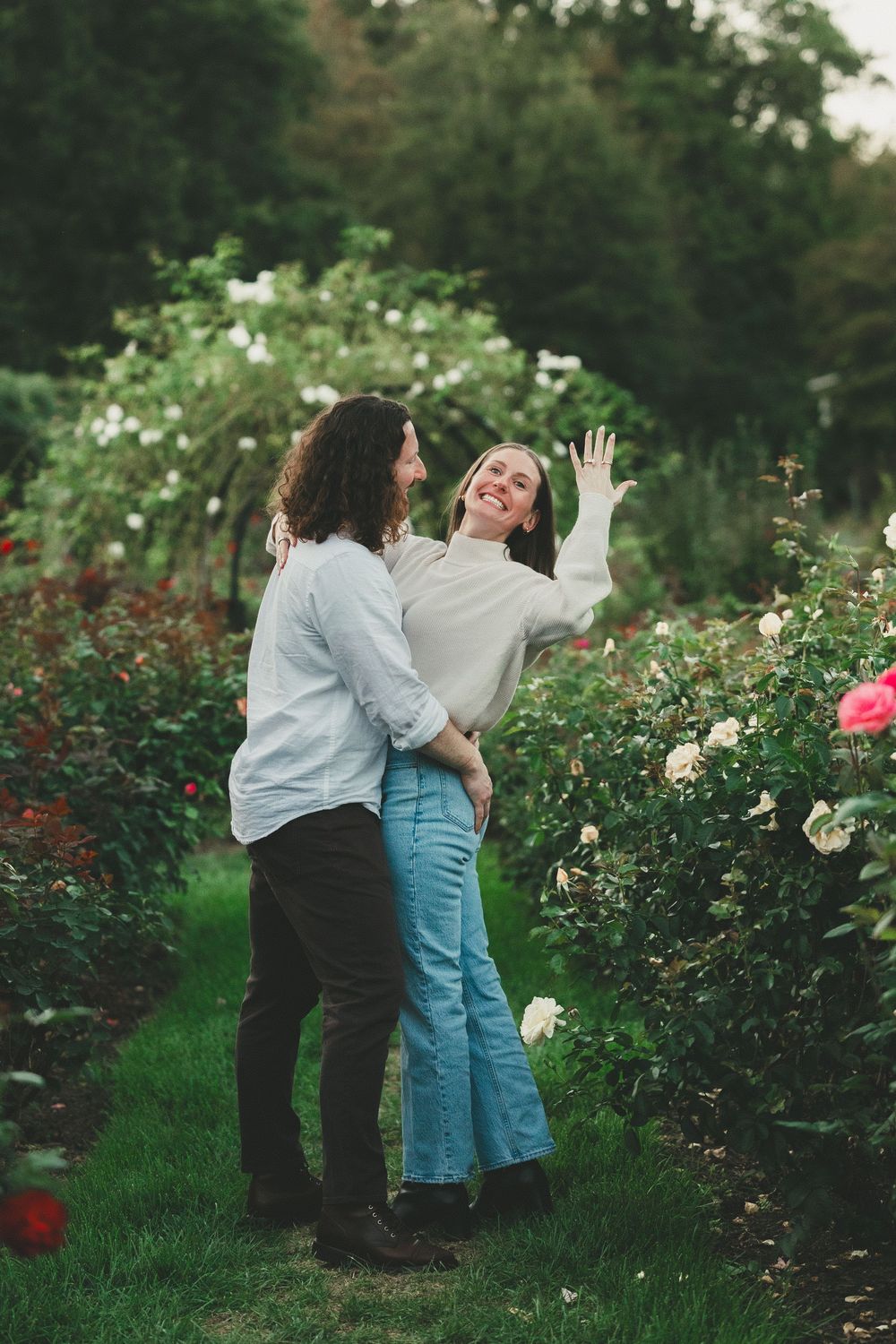 Couple celebrating after Bon Air Rose Garden proposal in Arlington VA