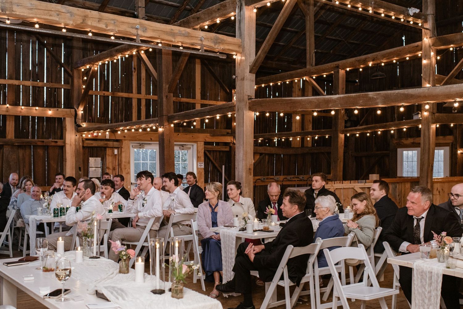 Elegant barn wedding floor plan featuring open guest seating, wooden harvest tables, and clear reception flow at Black Saddle Barn.
