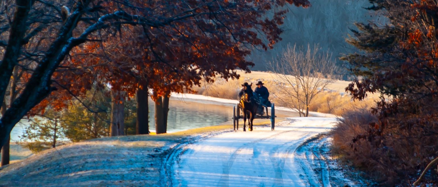 Amish horse and buggy on snow covered country road in winter Northern Missouri