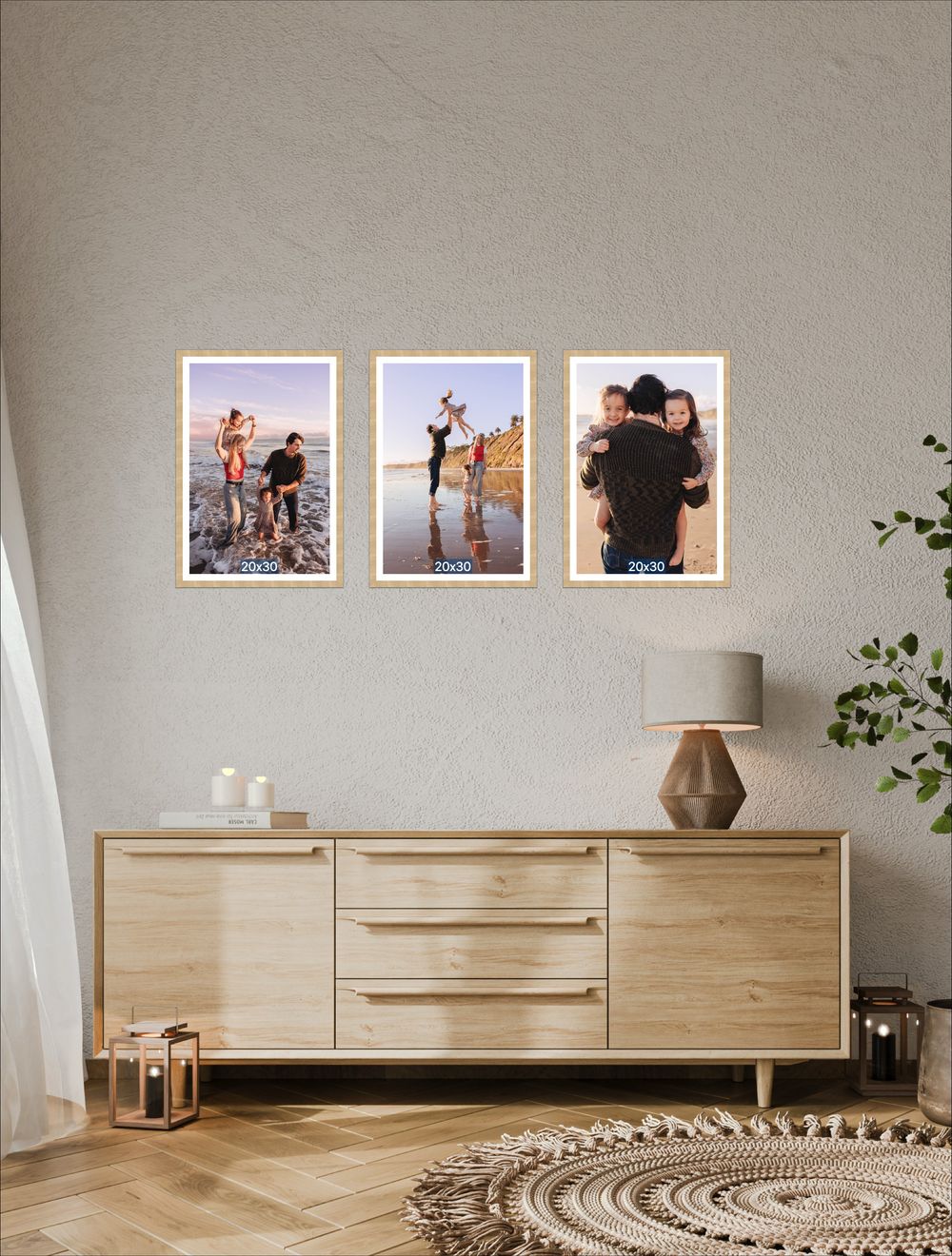 Three framed family beach photos displayed on a neutral wall above a modern wooden sideboard in a Scandinavian-style living room.