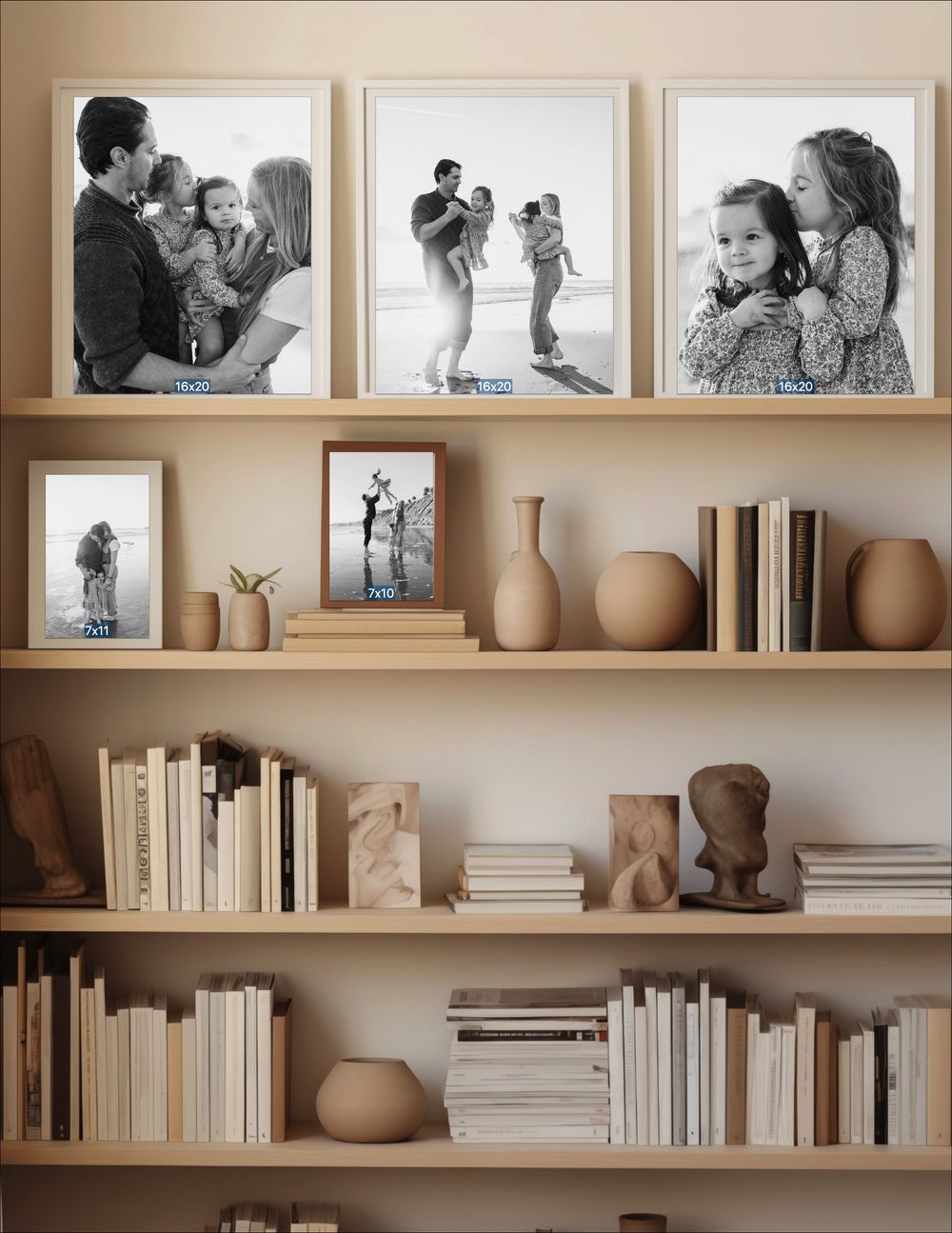 Black and white family photos displayed in wooden frames on a styled bookshelf with vases and books.