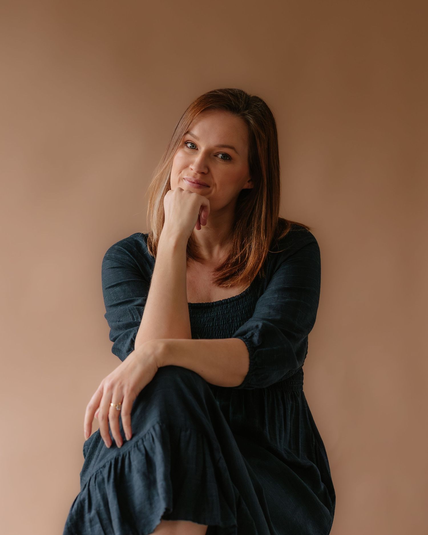 Thoughtful self-portrait of Harriet, the face behind Juniper Photography; Bristol's mobile newborn and outdoor family photographer.