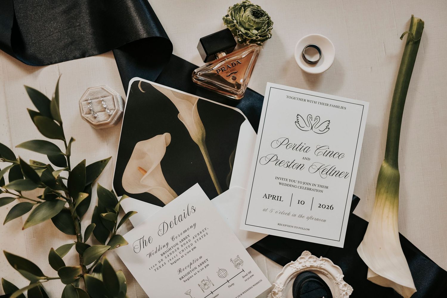luxury wedding invitation suite flat lay with gold accents and elegant styling