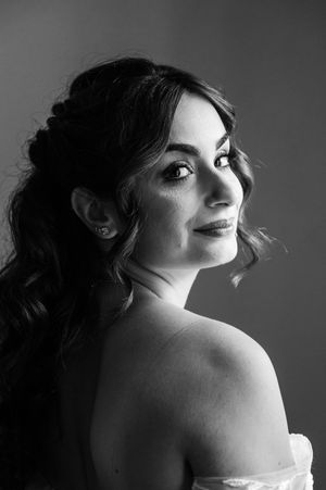 Black and white artistic portraits showing dramatic angles and lighting of a woman in boudoir style.
