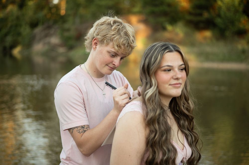A romantic couple shares intimate moments by a serene lake during a golden autumn sunset.