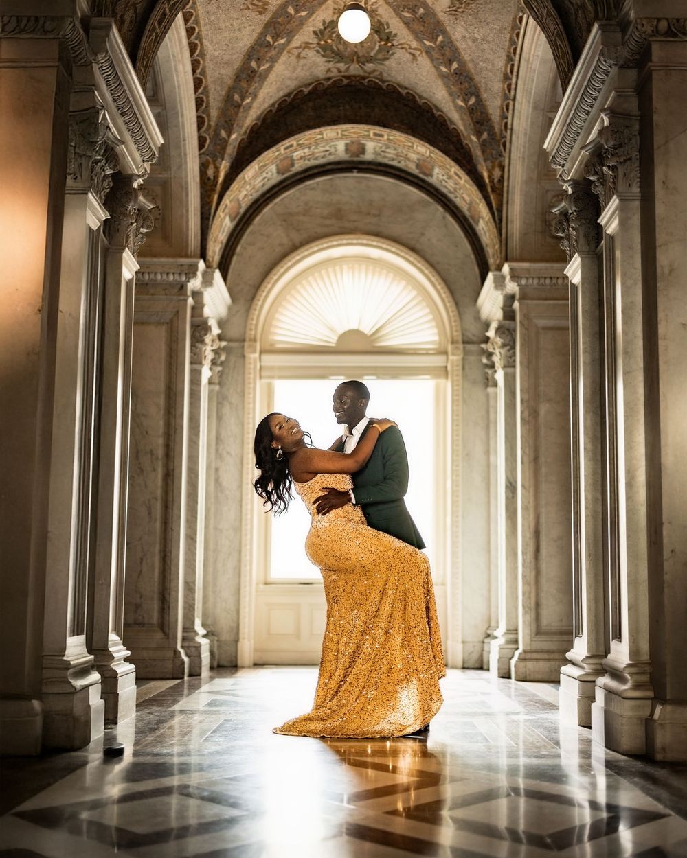 A couple dances romantically in an elegant marble hallway with arched ceilings and classical architecture.