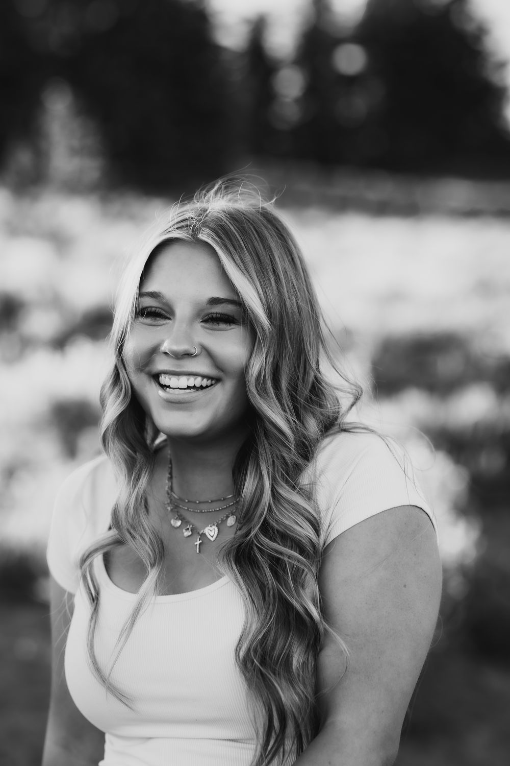 Black and white candid portraits showing genuine laughter and happiness.