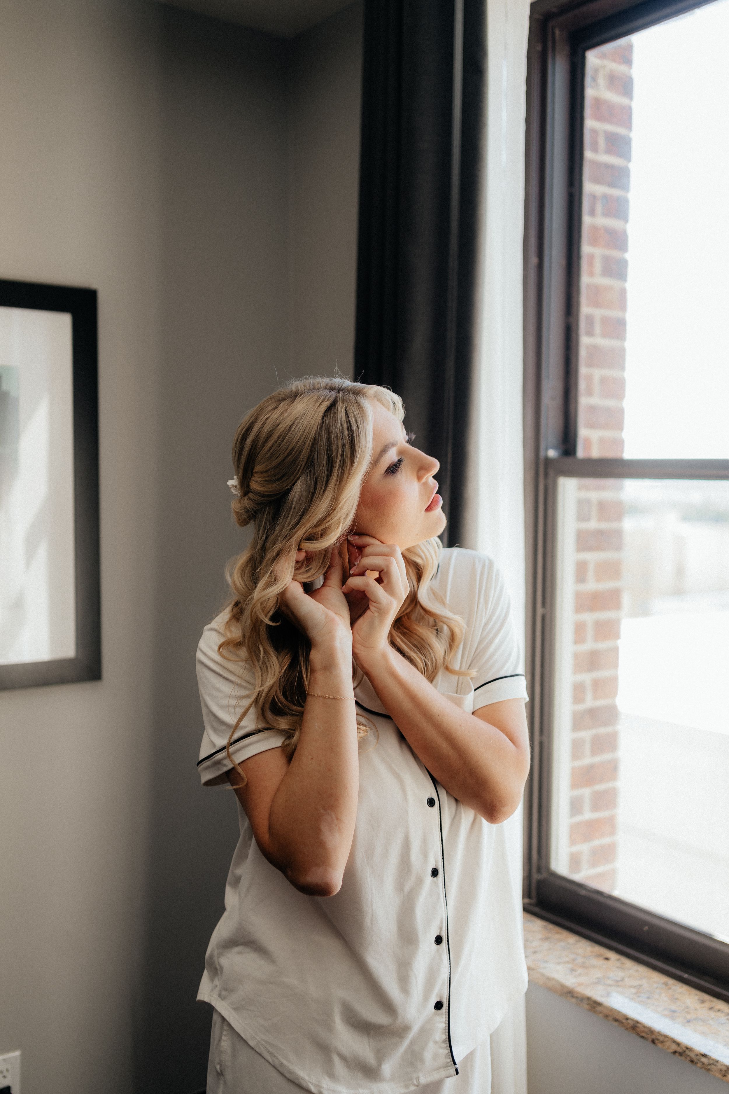 A sequence of getting ready photos showing final touches being made near a window.