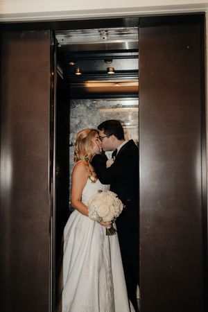 A romantic sequence of wedding photos captured in a dimly lit elevator.