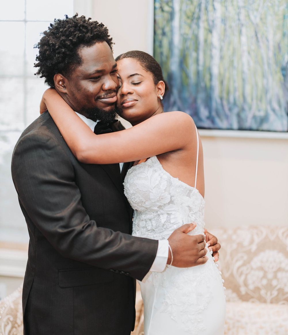 A loving couple shares an intimate embrace during their wedding celebration.