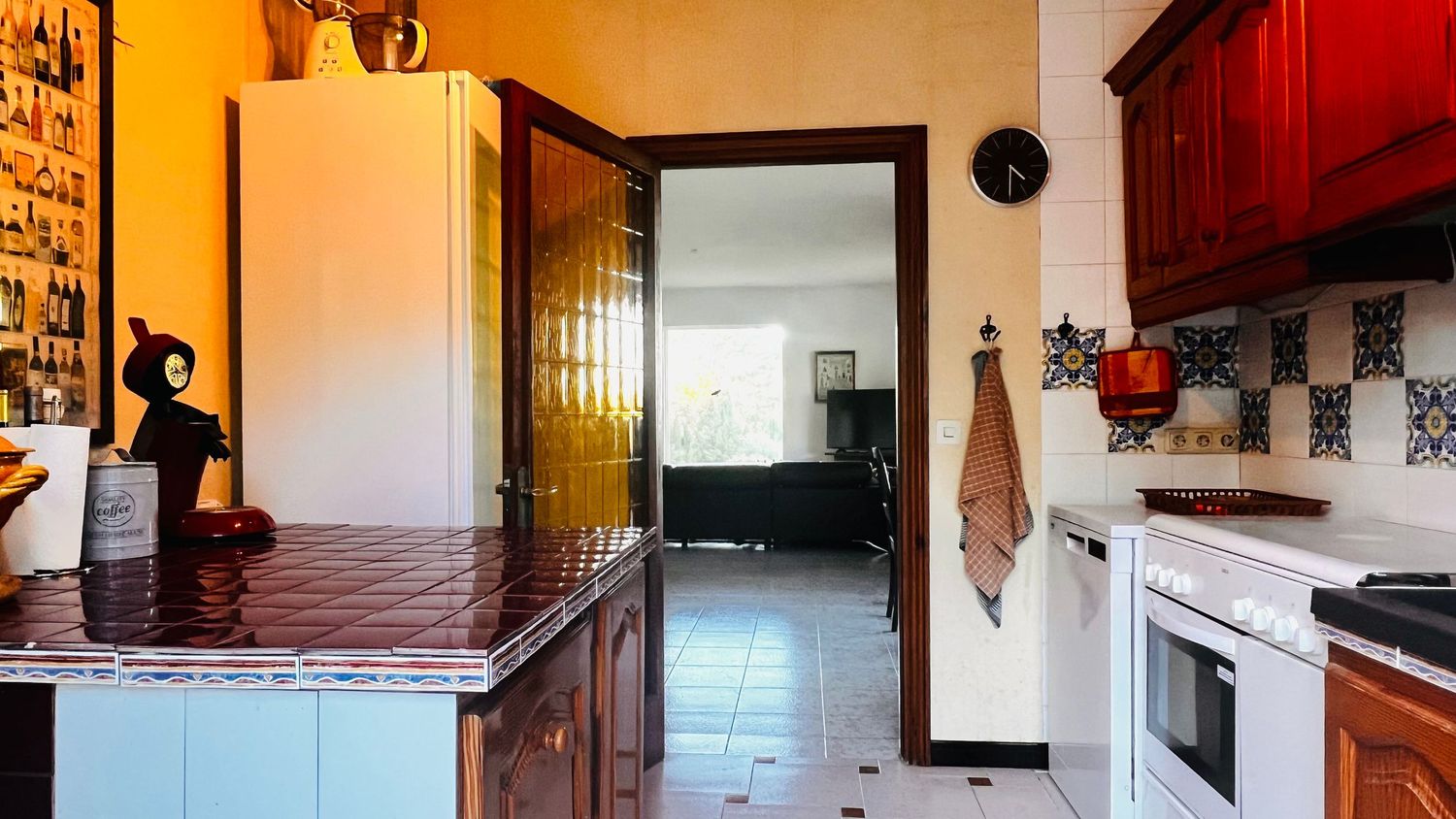 A panoramic interior view of a rustic cabin showing wooden beams, kitchen area and living spaces.