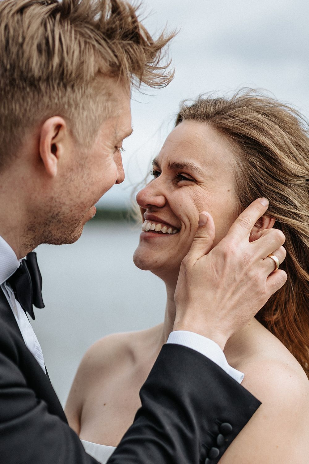 A series of intimate close-up shots showing a newlywed couple's loving embrace and joyful smiles.