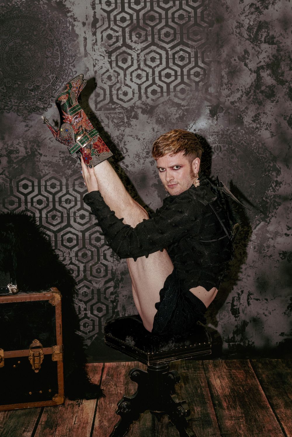 Studio portrait at Forgotten Works Studio Portland featuring dramatic lighting and acrobatic styling