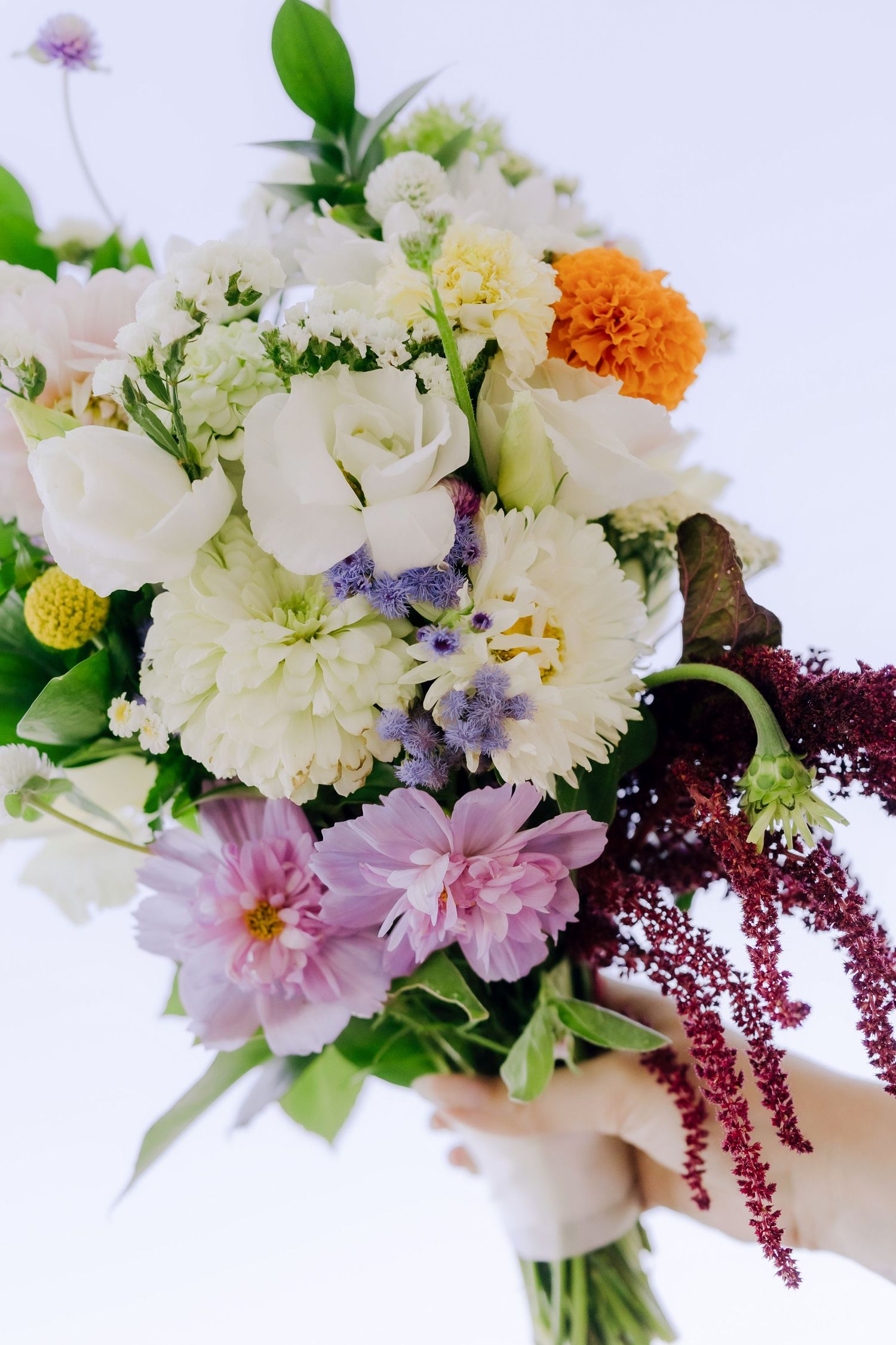 Summer color bridal bouquet with white and colorful flowers. Boise wedding florals. Milestones wedding planning, Boise wedding planner.